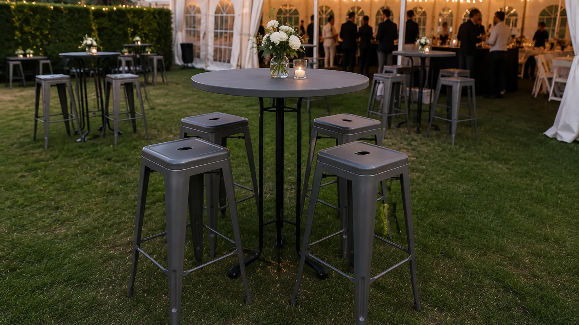 Elegant outdoor event furniture setup at dusk